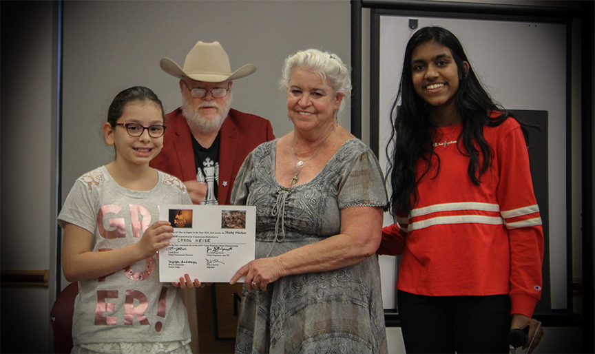 From left to right: Deputy Master of Ceremonies Anneliese Garcia; Chief Organizer and Fundraiser Jim Hollingsworth; Carol Heise; and Games Judge Sharon Basepogu. Photo by Sheryl Mc Broom at North Richland Hills Library.